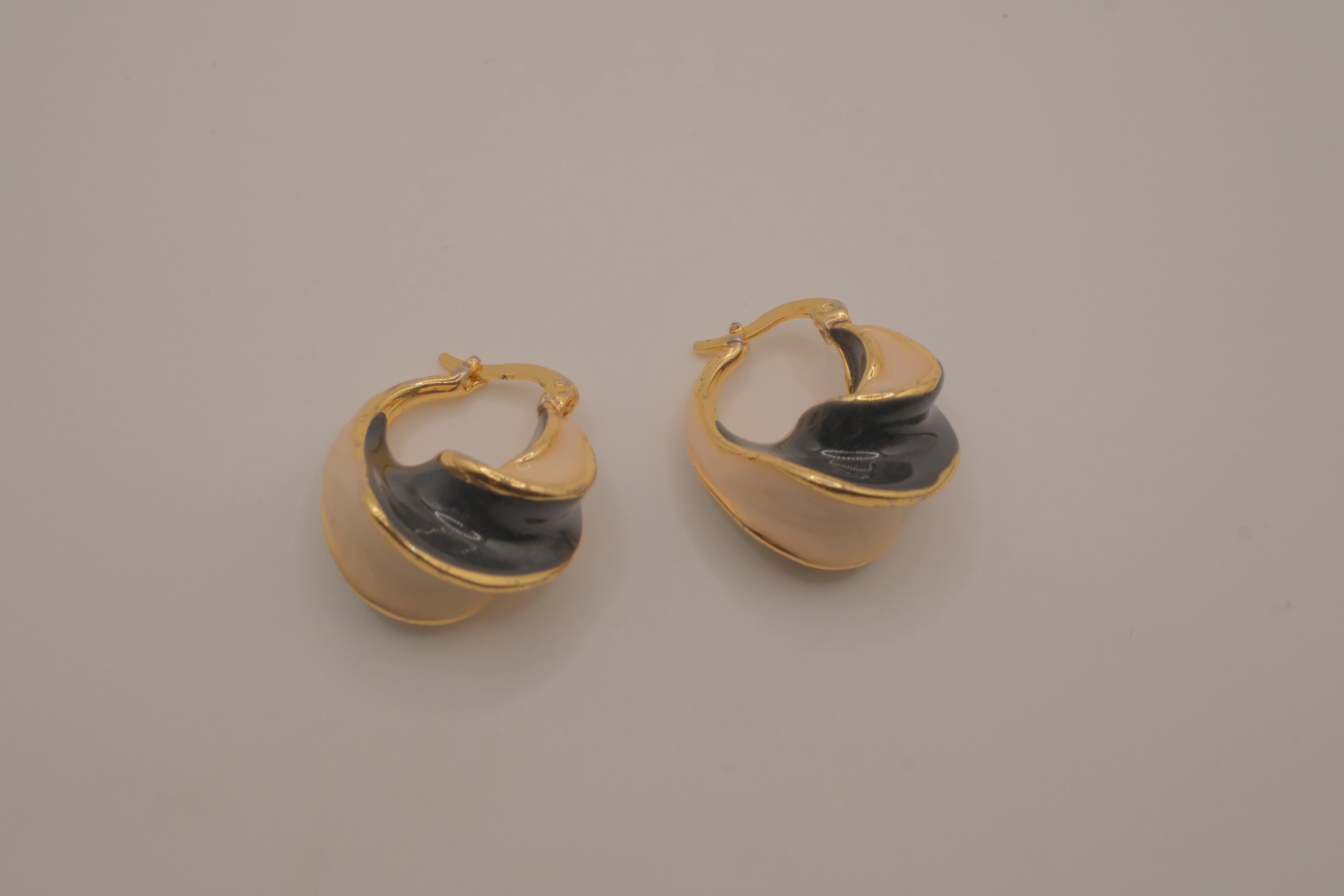 Vintage two-tone enamel twisted hoop earrings