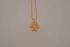 Gold flower pendant necklace