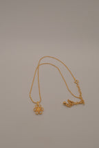 Gold flower pendant necklace