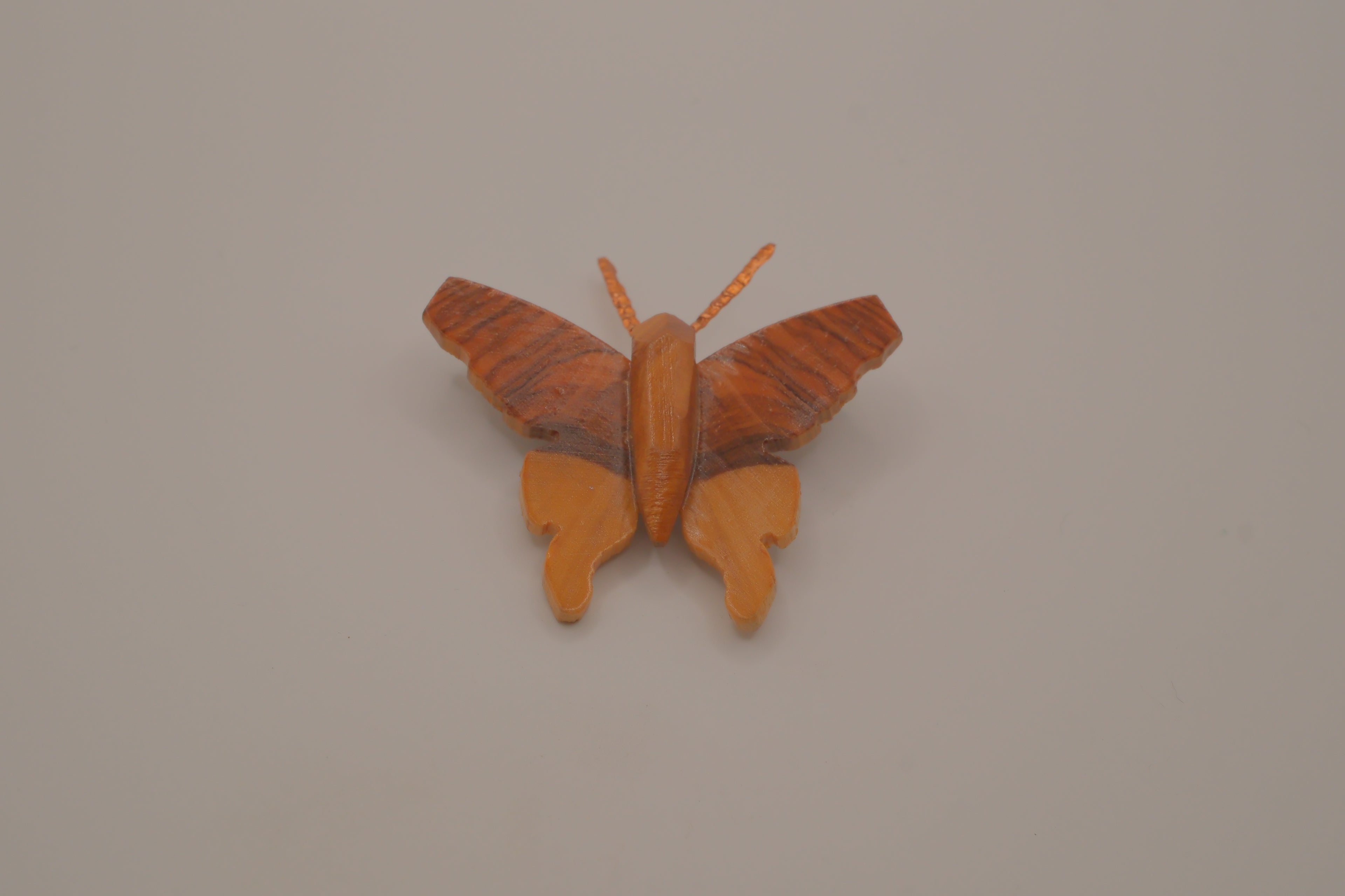 Hand-carved olive wood butterfly brooch