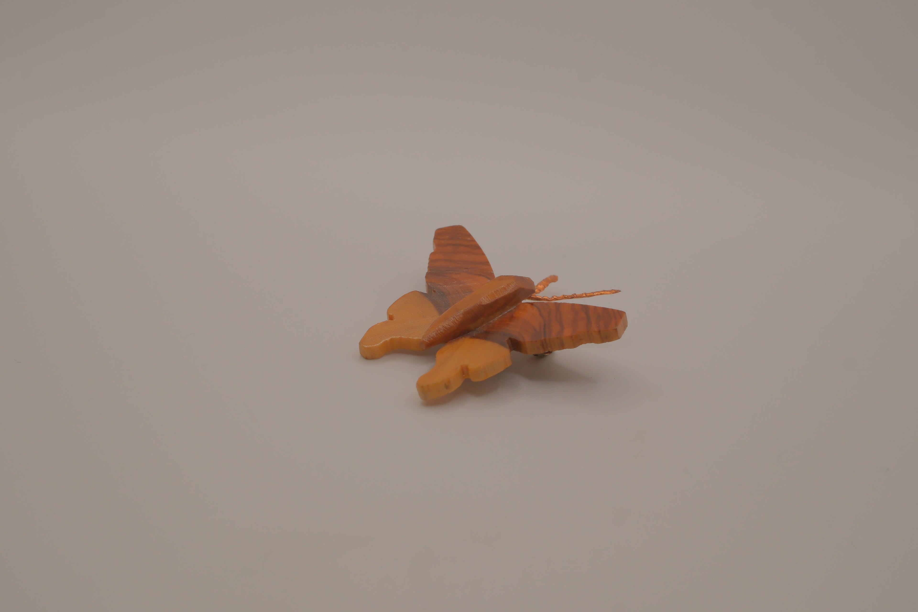 Hand-carved olive wood butterfly brooch