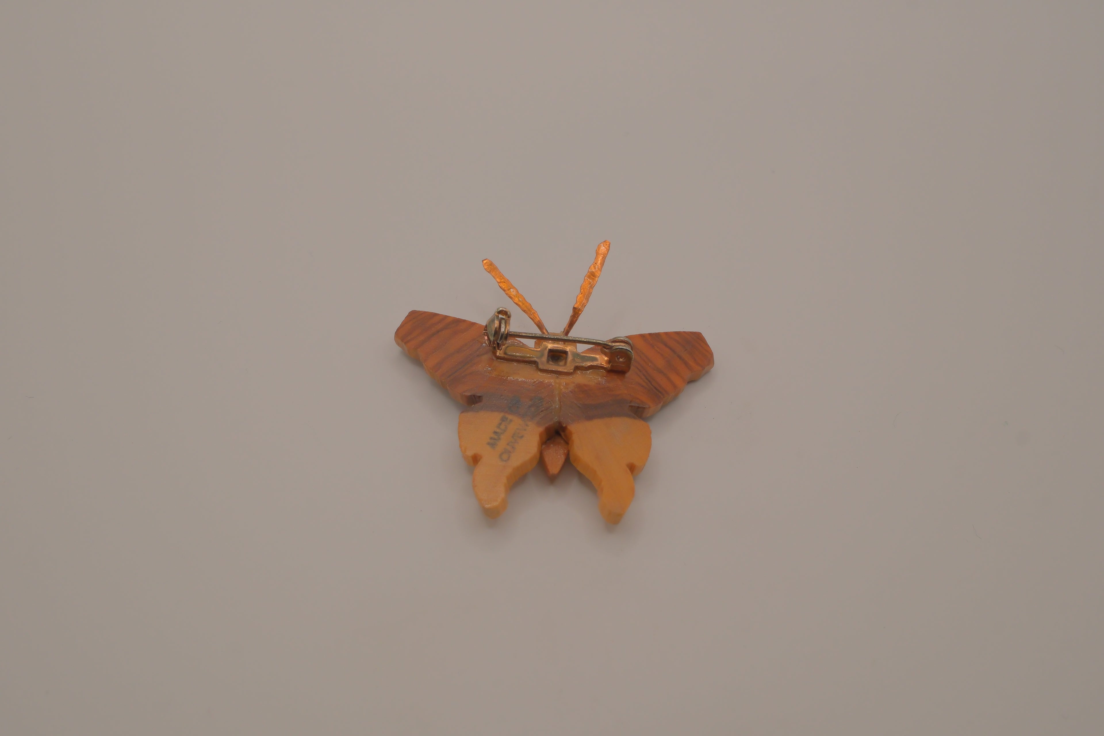 Hand-carved olive wood butterfly brooch