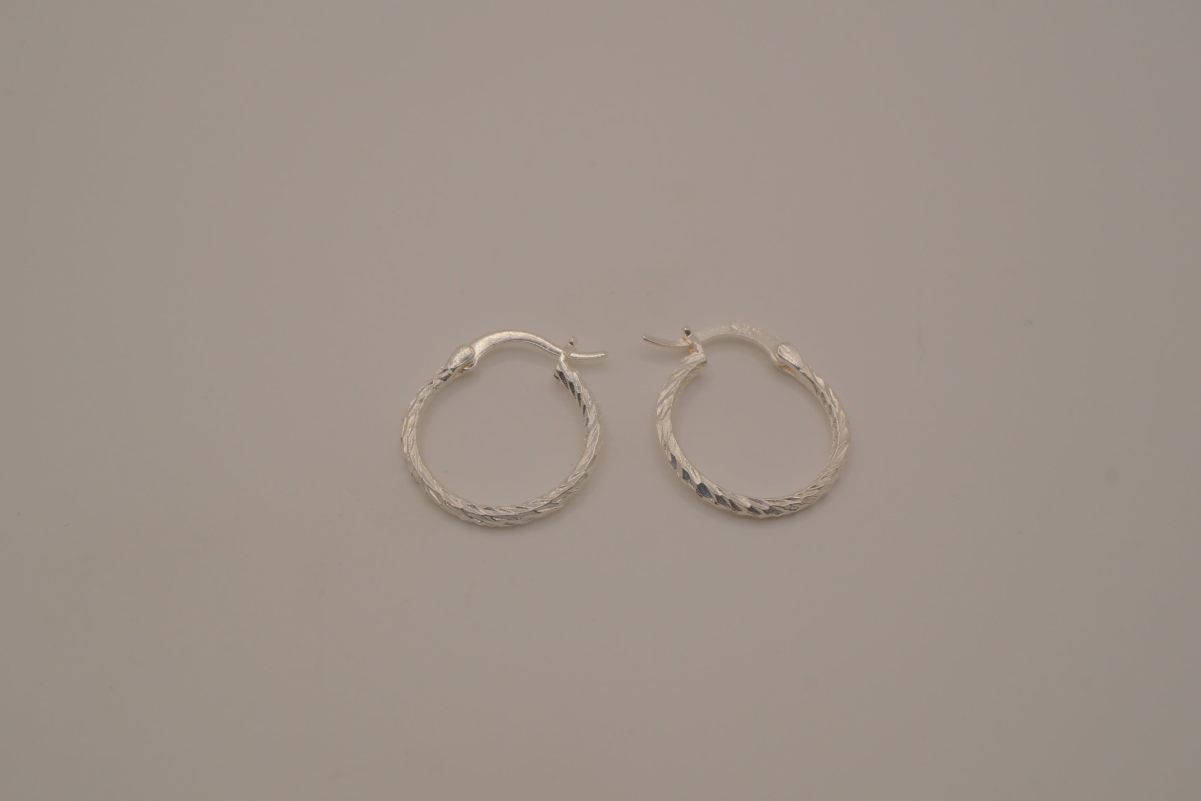 Diamond-cut sterling silver hoop earrings