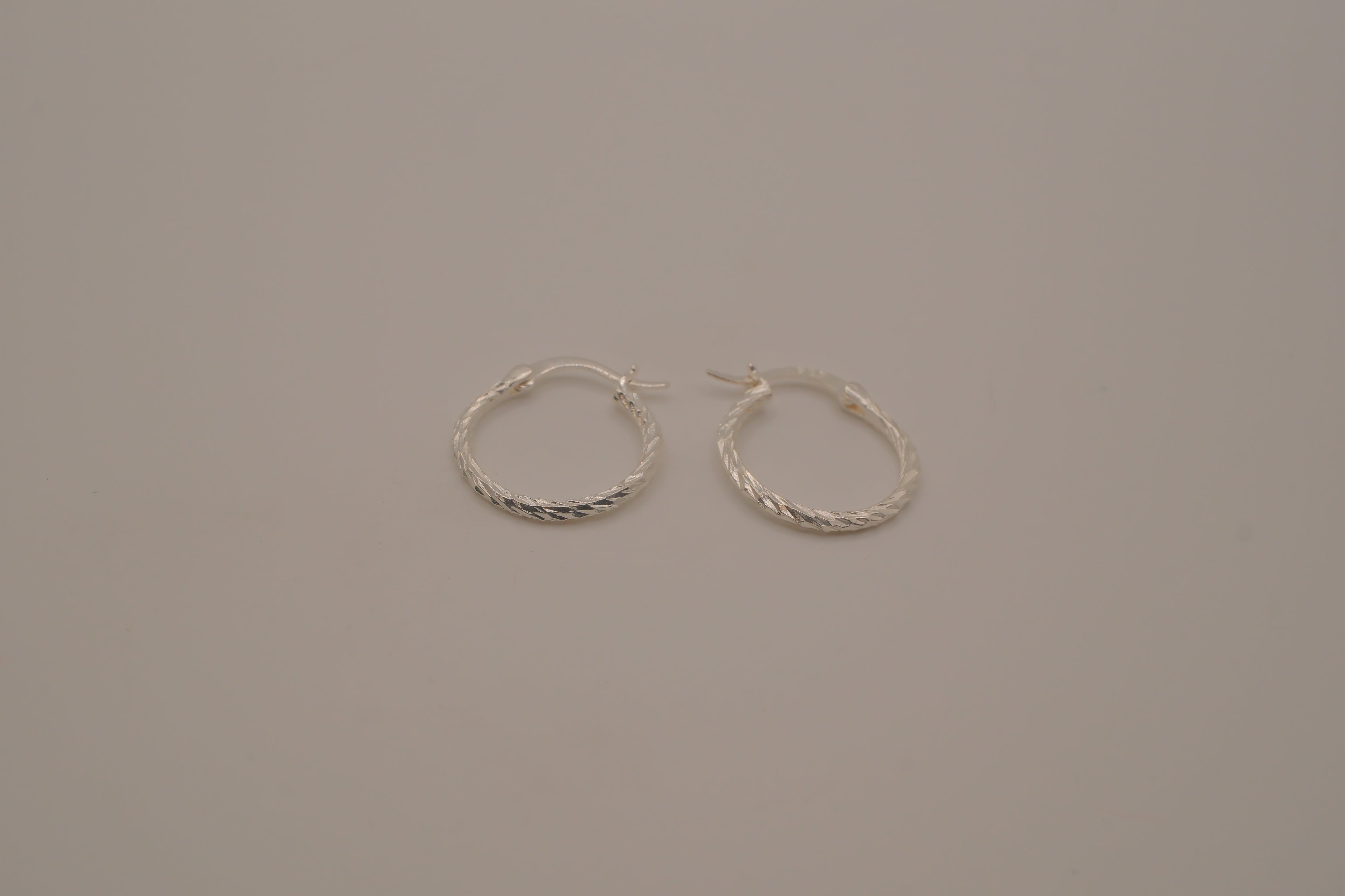 Diamond-cut sterling silver hoop earrings