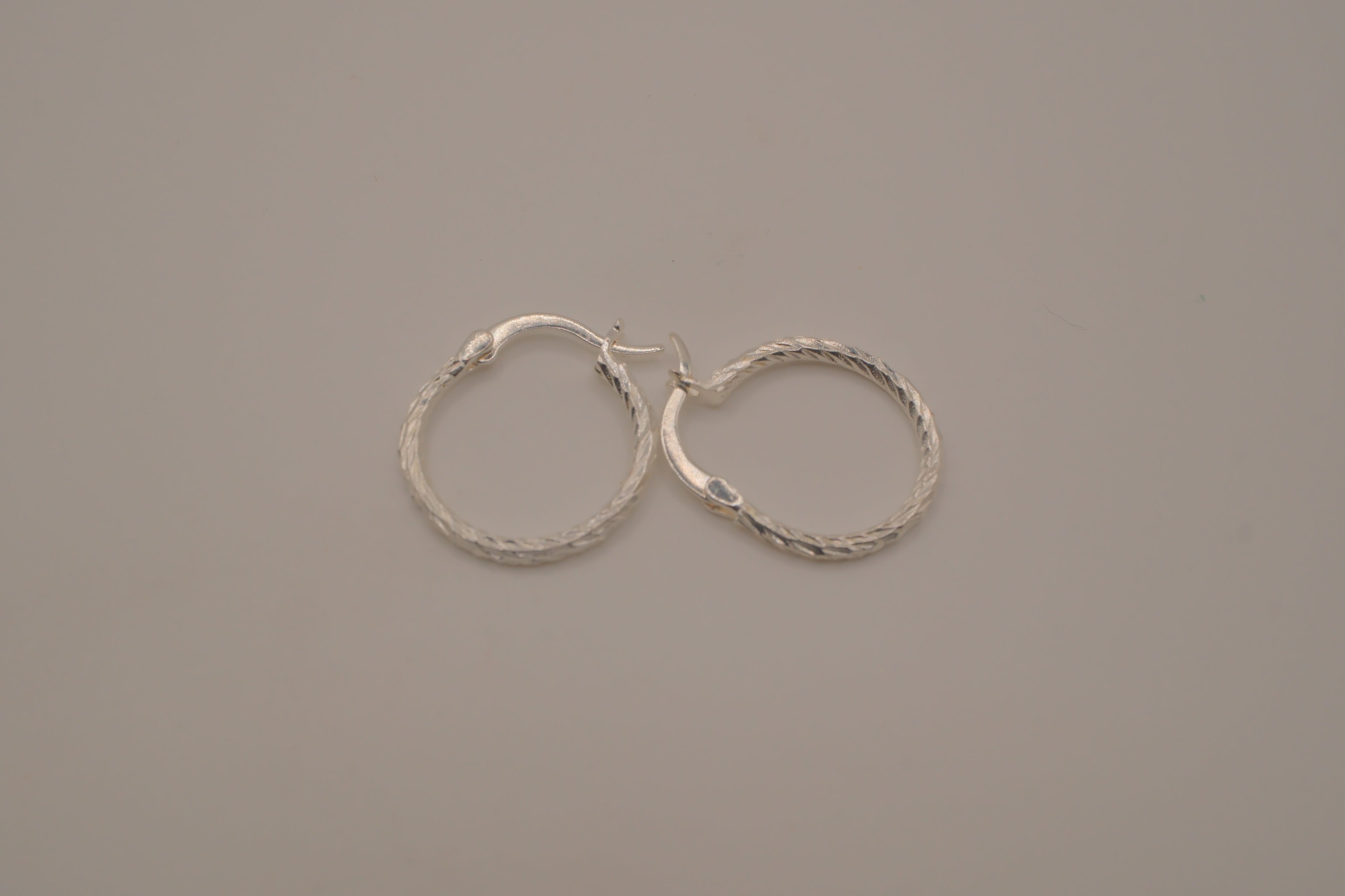 Diamond-cut sterling silver hoop earrings