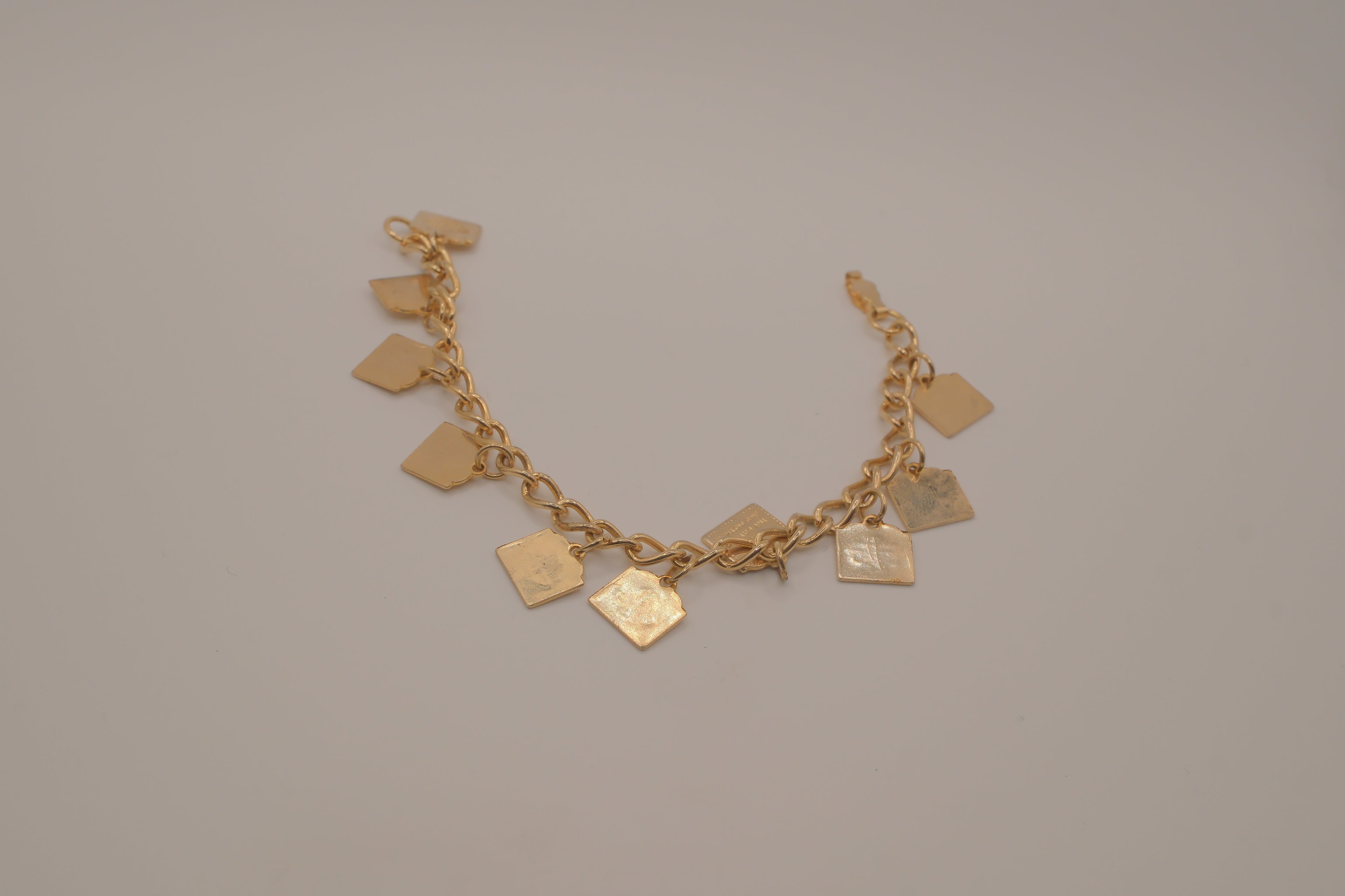 Vintage gold-tone Ten Commandments charm bracelet