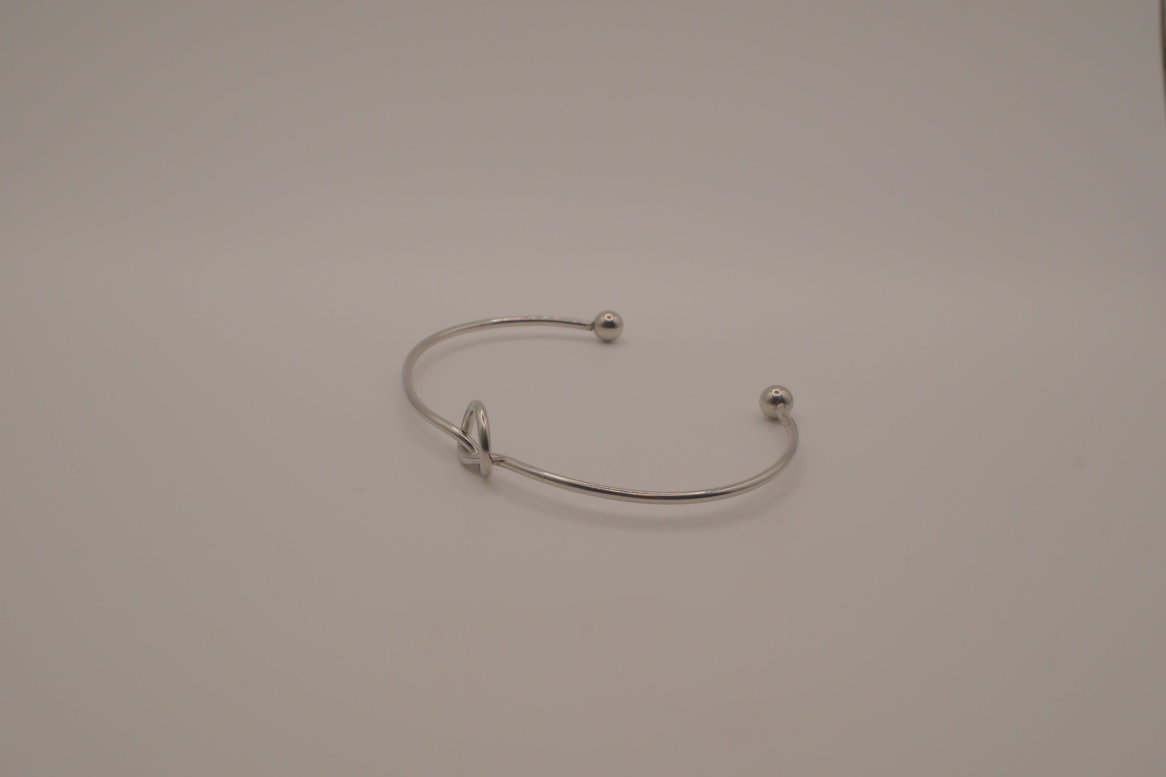Minimalist silver love knot cuff bracelet