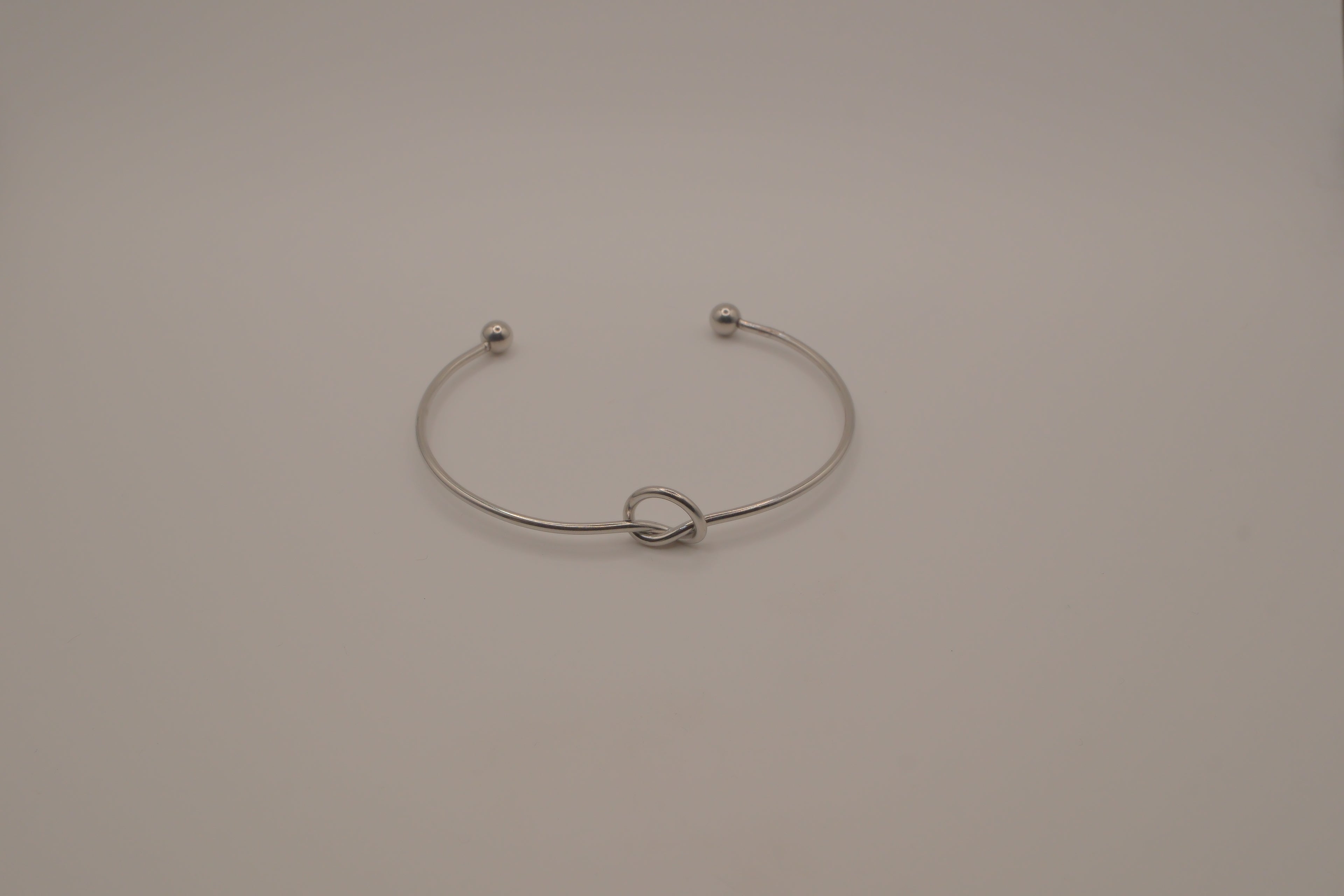 Minimalist silver love knot cuff bracelet