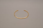 Avon minimalist gold-tone open cuff bracelet