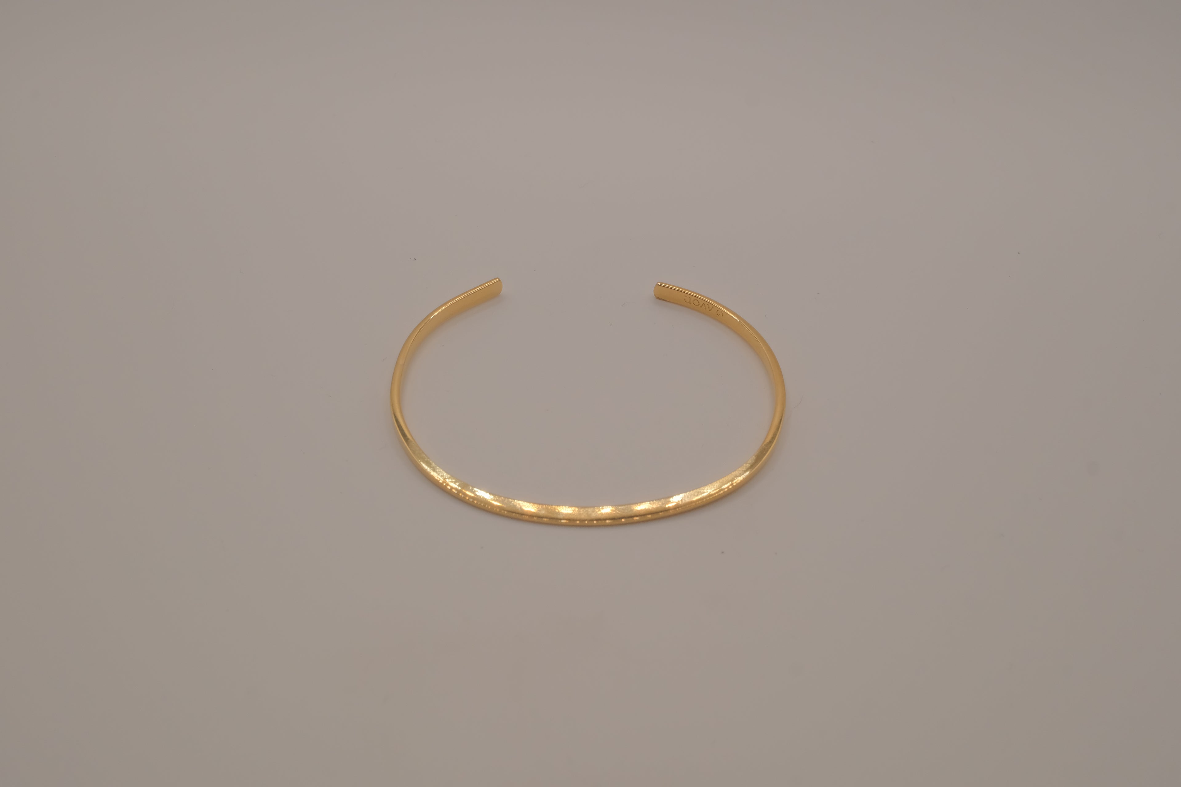 Avon minimalist gold-tone open cuff bracelet
