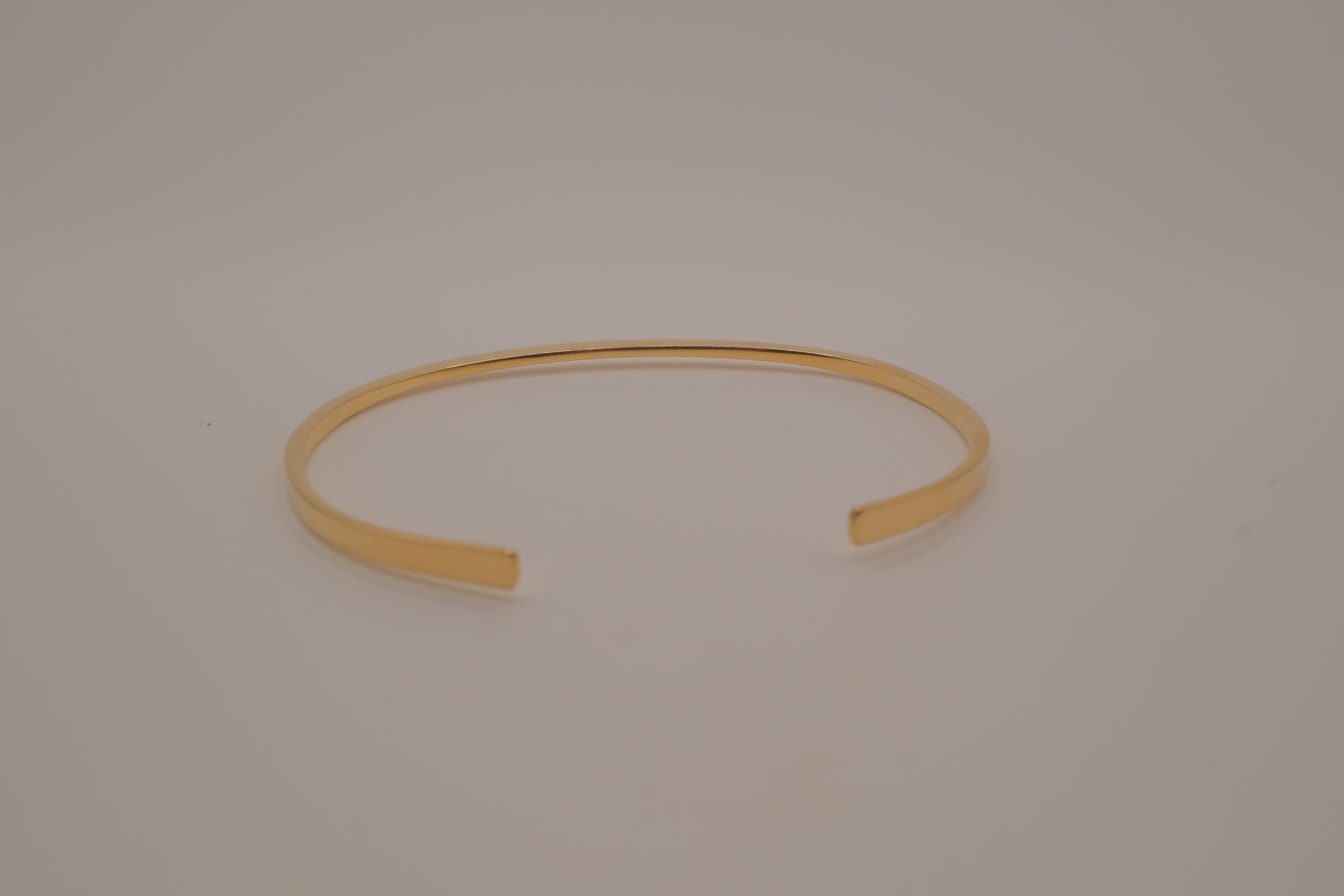 Avon minimalist gold-tone open cuff bracelet