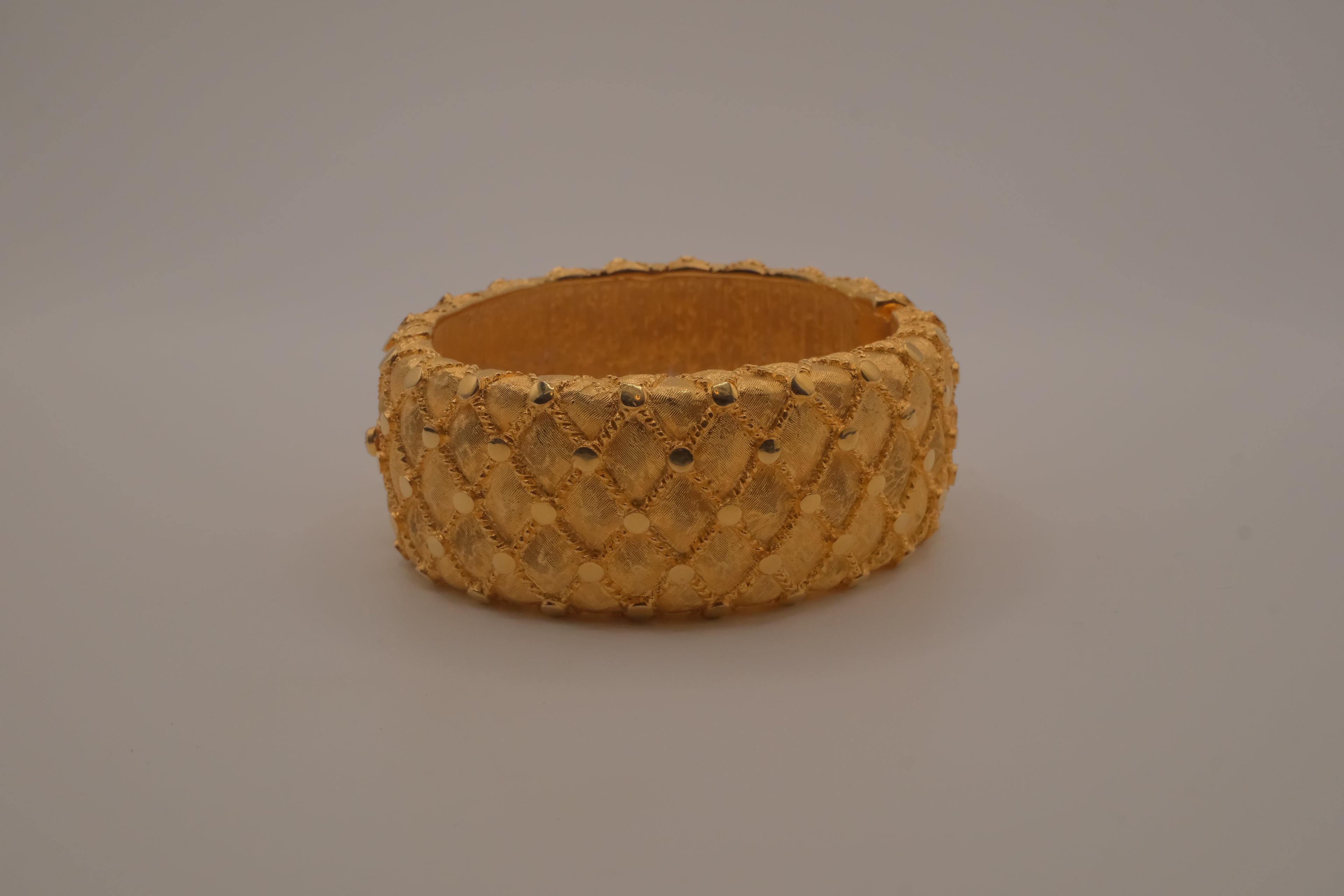 Avon gold textured quilted bangle bracelet