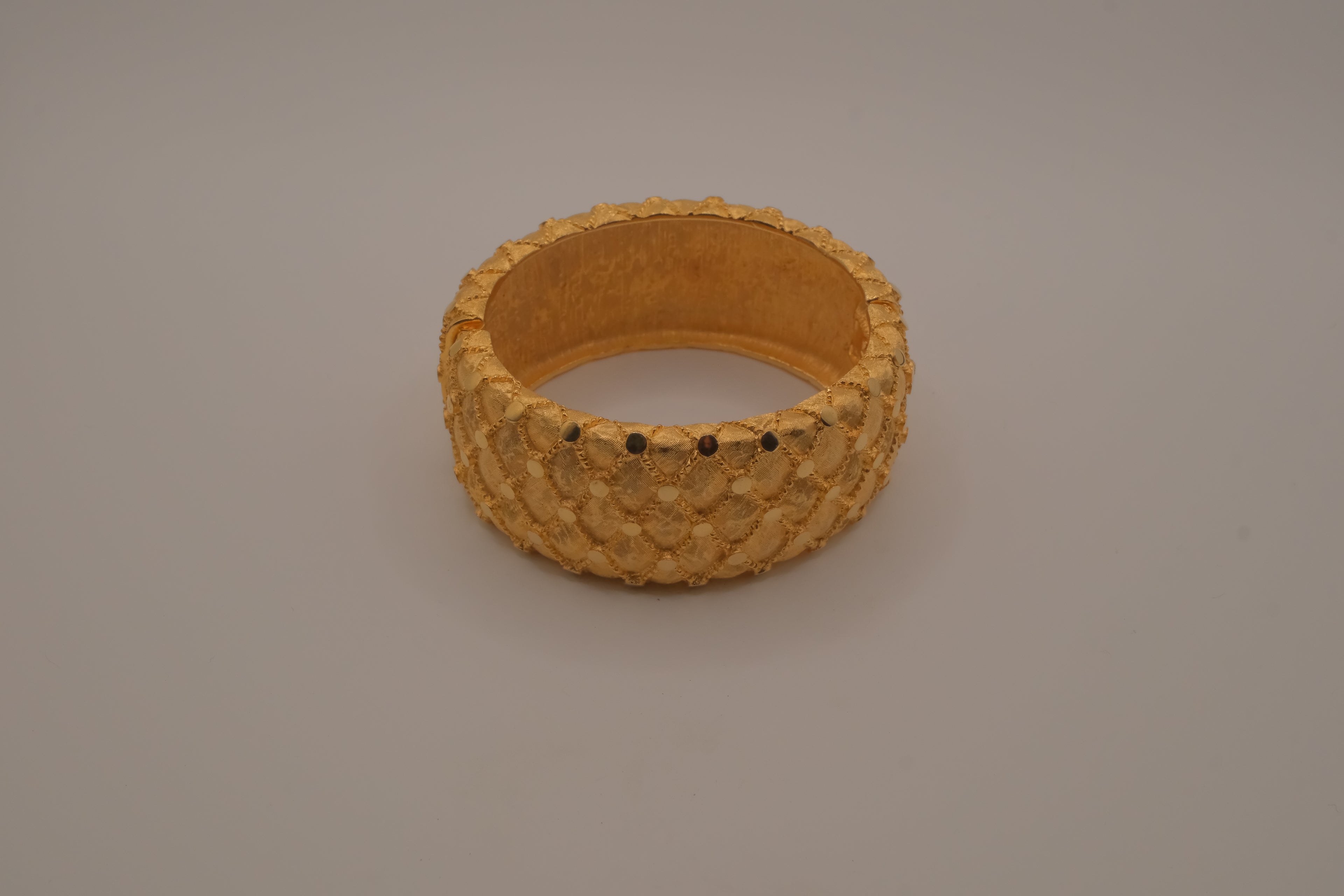 Avon gold textured quilted bangle bracelet