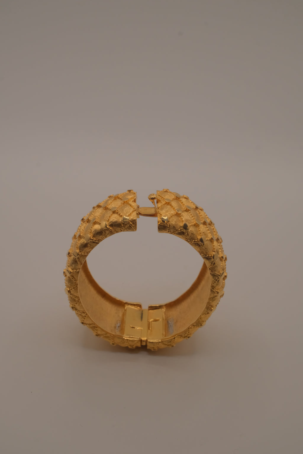 Avon gold textured quilted bangle bracelet