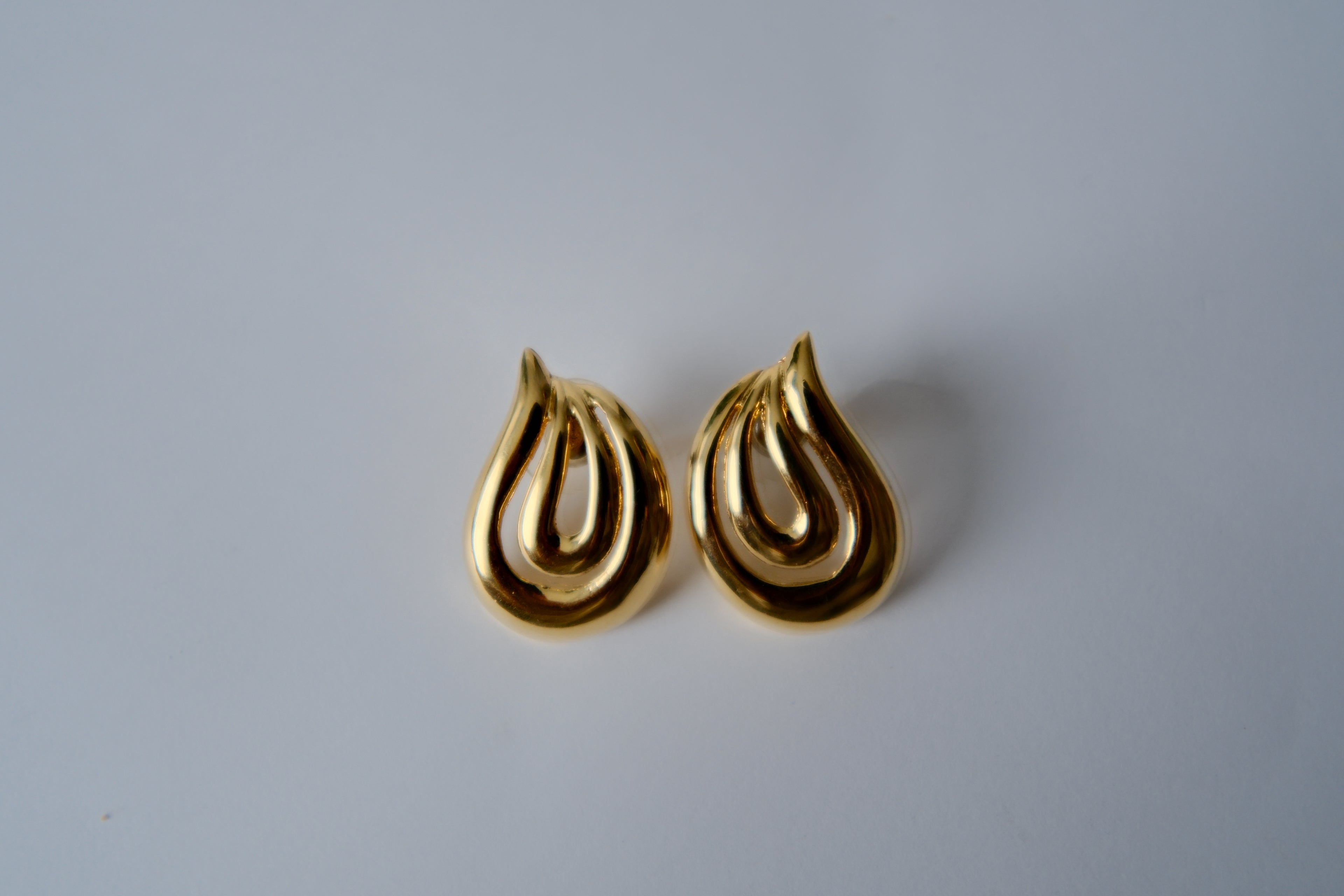 Vintage gold-toned swirl studded earrings