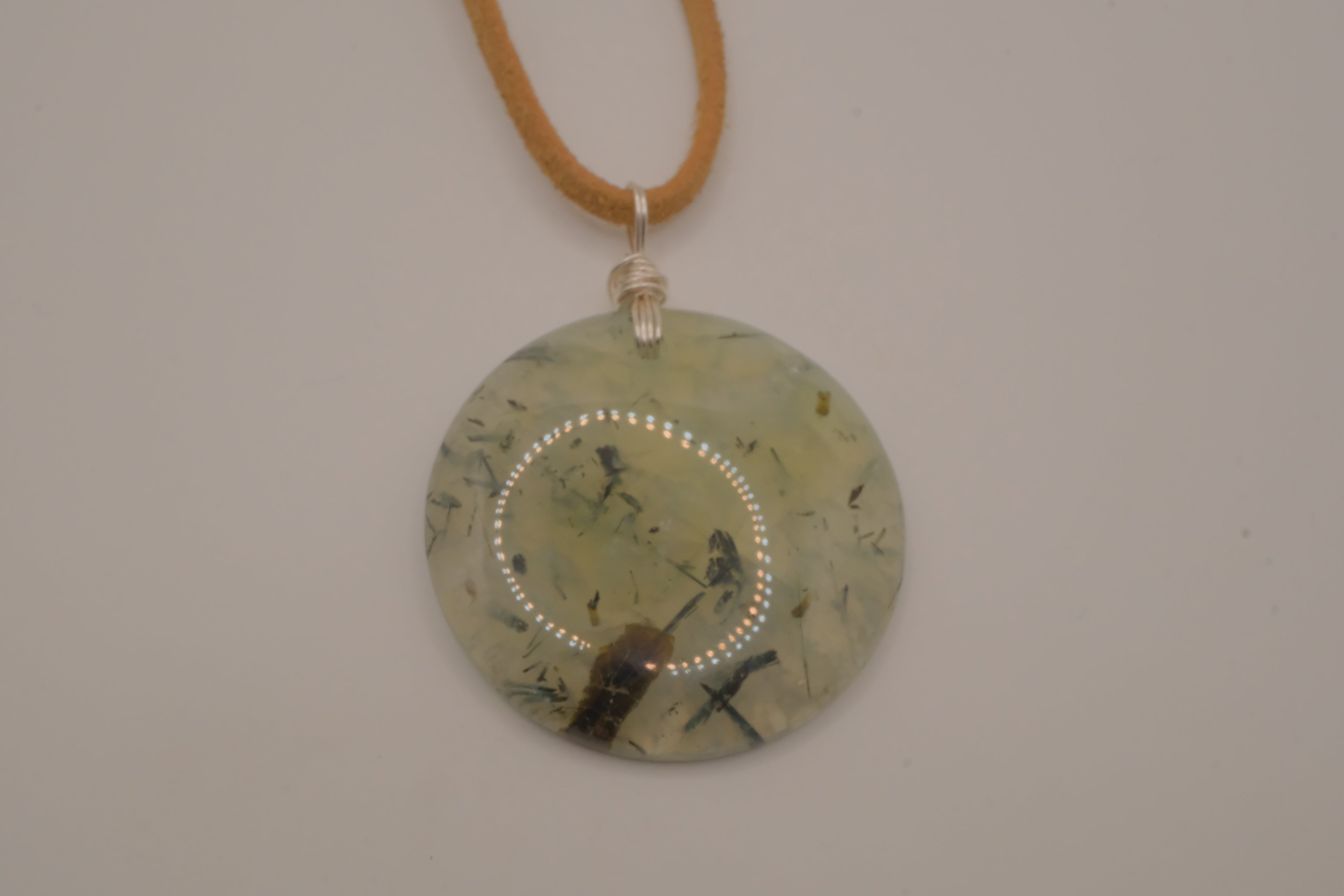 Natural prehnite pendant on leather cord