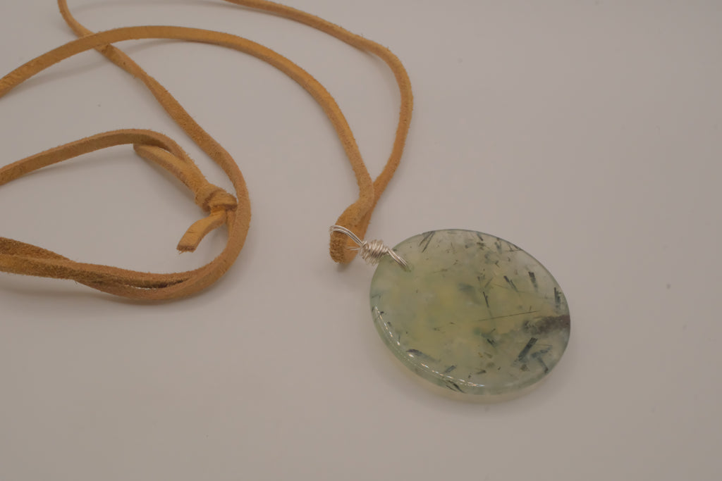 Natural prehnite pendant on leather cord