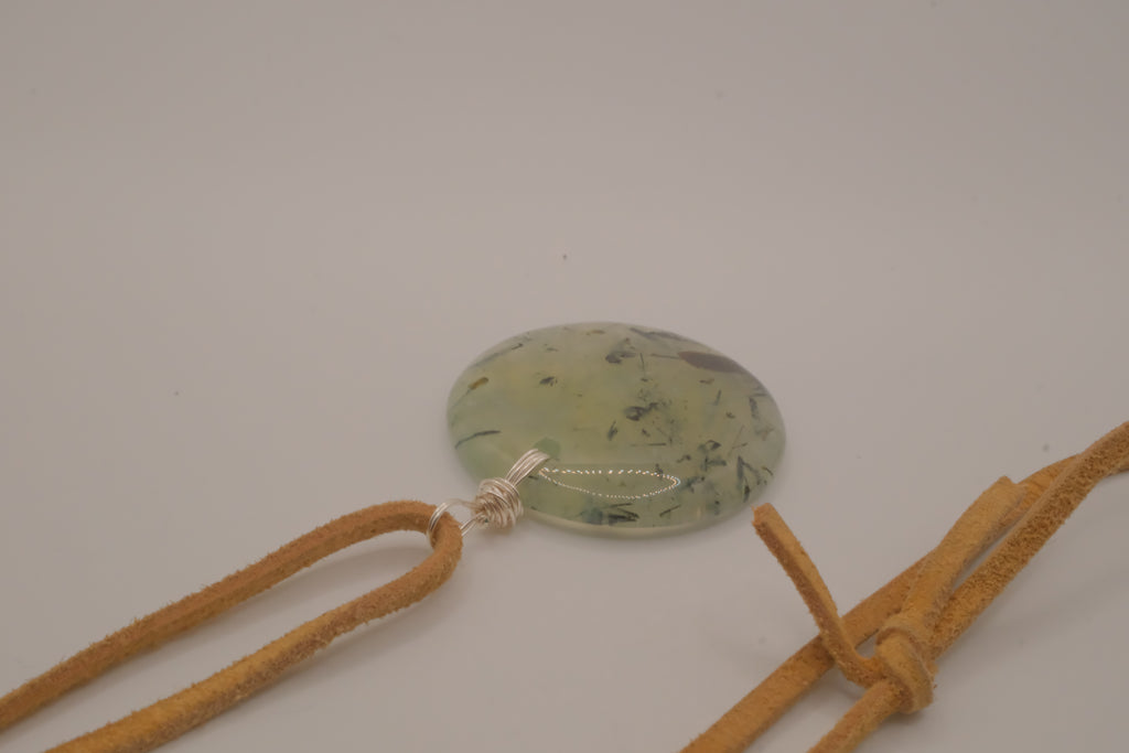 Natural prehnite pendant on leather cord