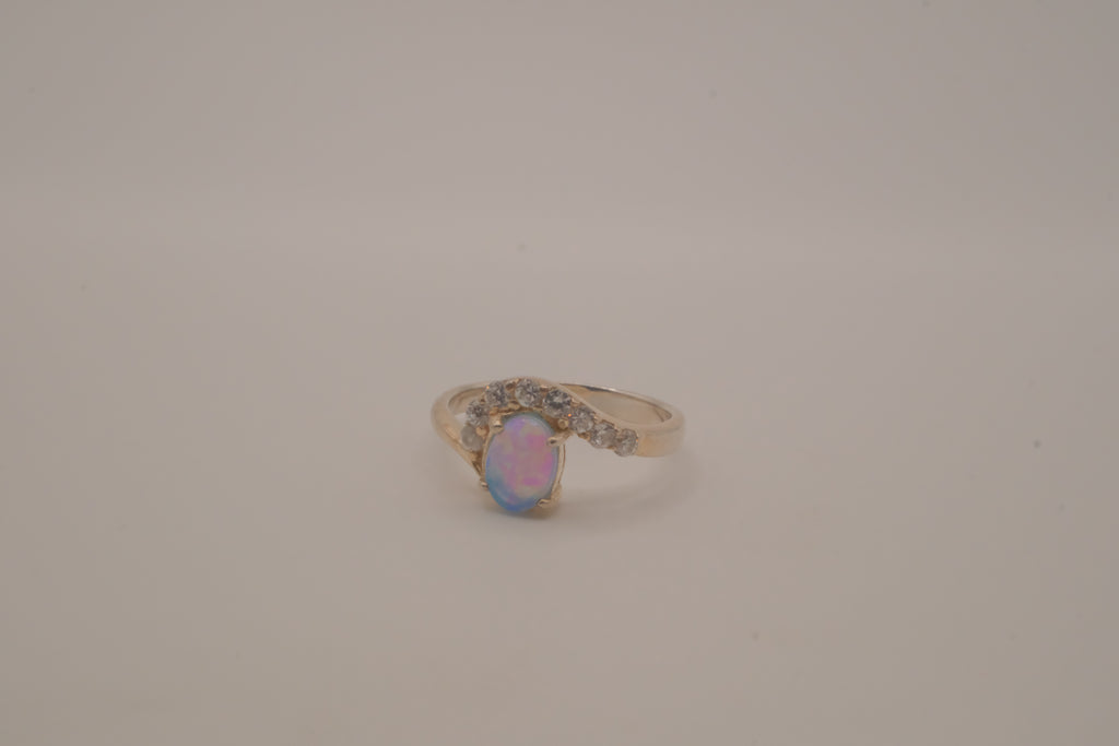 Sterling silver oval opal ring with a curved accent band