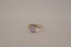 Sterling silver oval opal ring with a curved accent band
