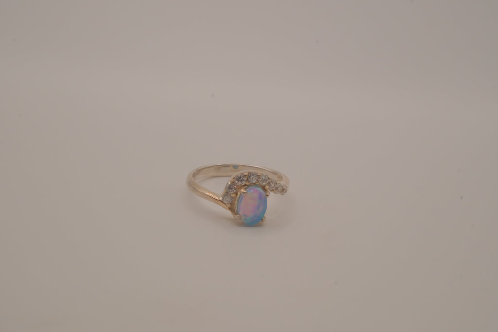 Sterling silver oval opal ring with a curved accent band