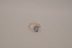 Sterling silver oval opal ring with a curved accent band