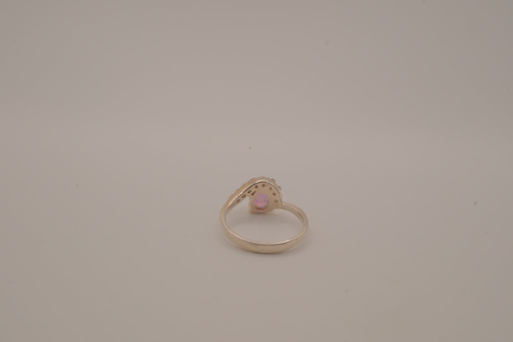 Sterling silver oval opal ring with a curved accent band
