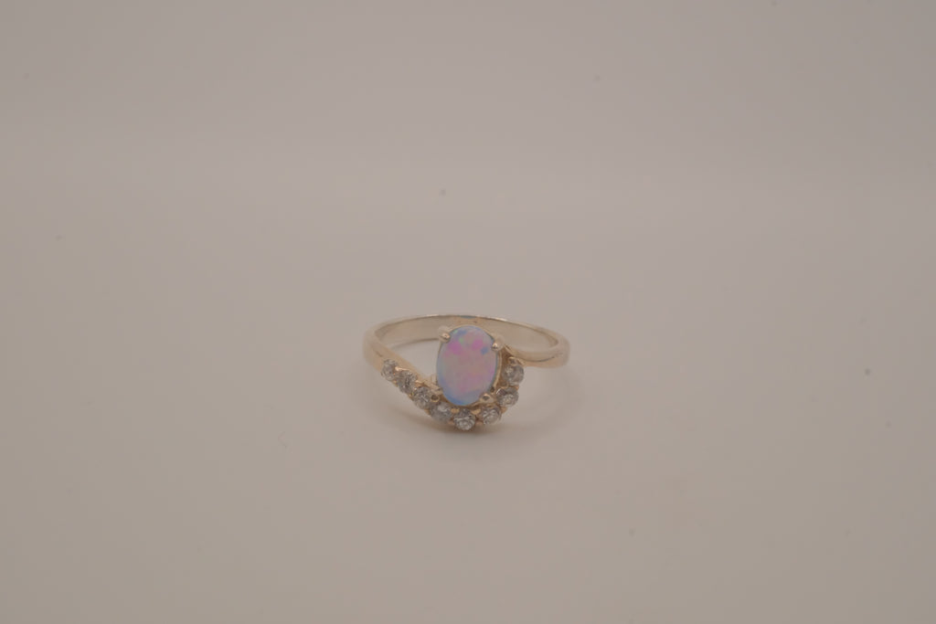 Sterling silver oval opal ring with a curved accent band