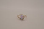 Sterling silver oval opal ring with a curved accent band