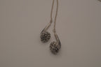 Novelty headphone or earbud-shaped pendant necklace