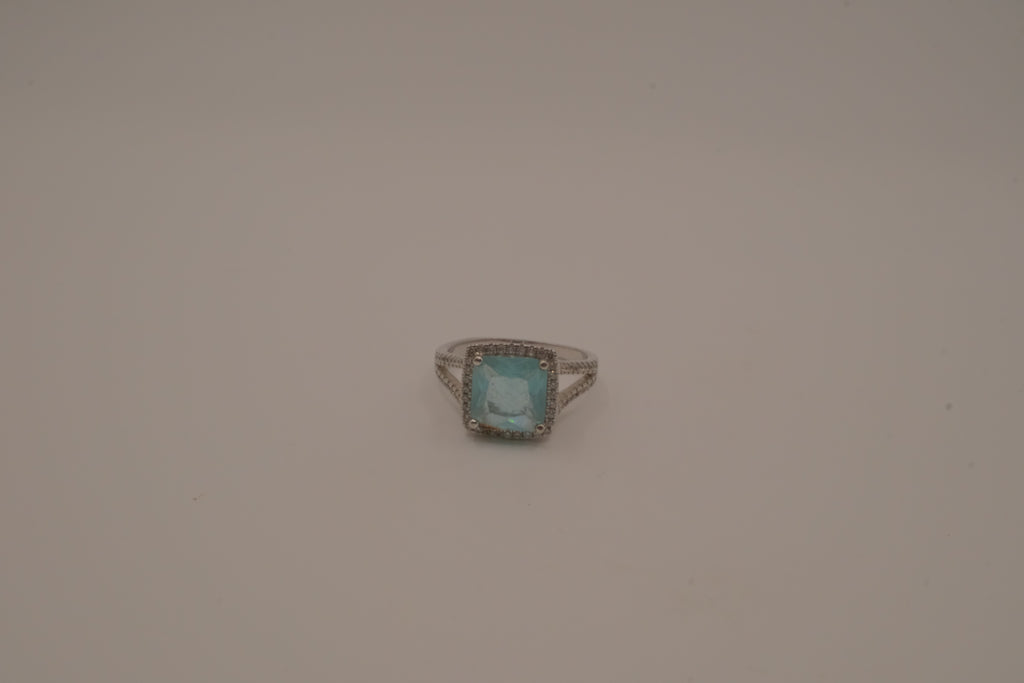 Cushion-cut blue stone halo ring