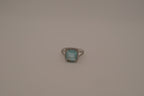Cushion-cut blue stone halo ring