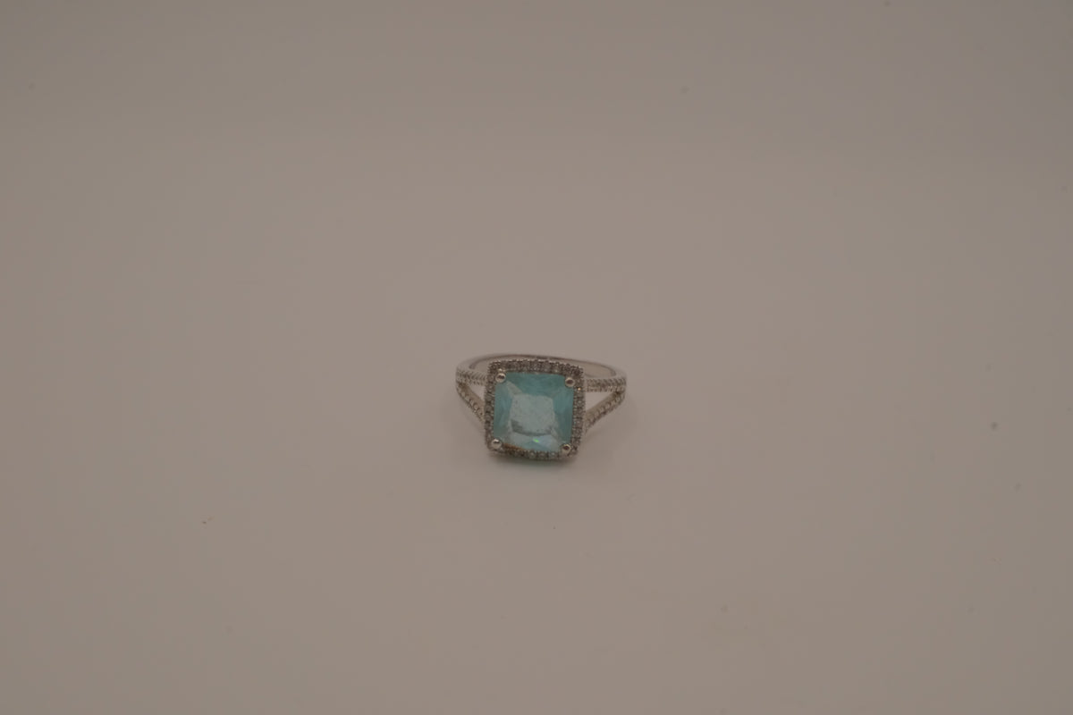 Cushion-cut blue stone halo ring