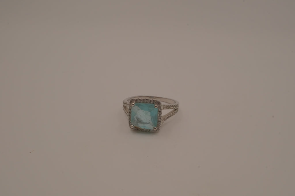 Cushion-cut blue stone halo ring