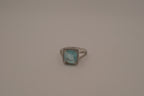 Cushion-cut blue stone halo ring