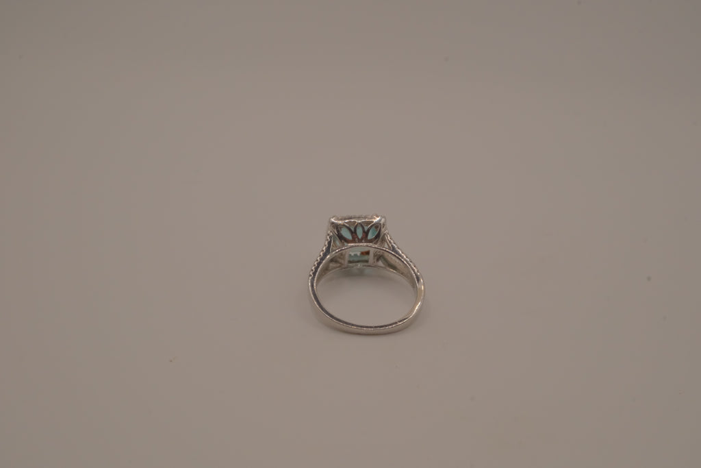 Cushion-cut blue stone halo ring