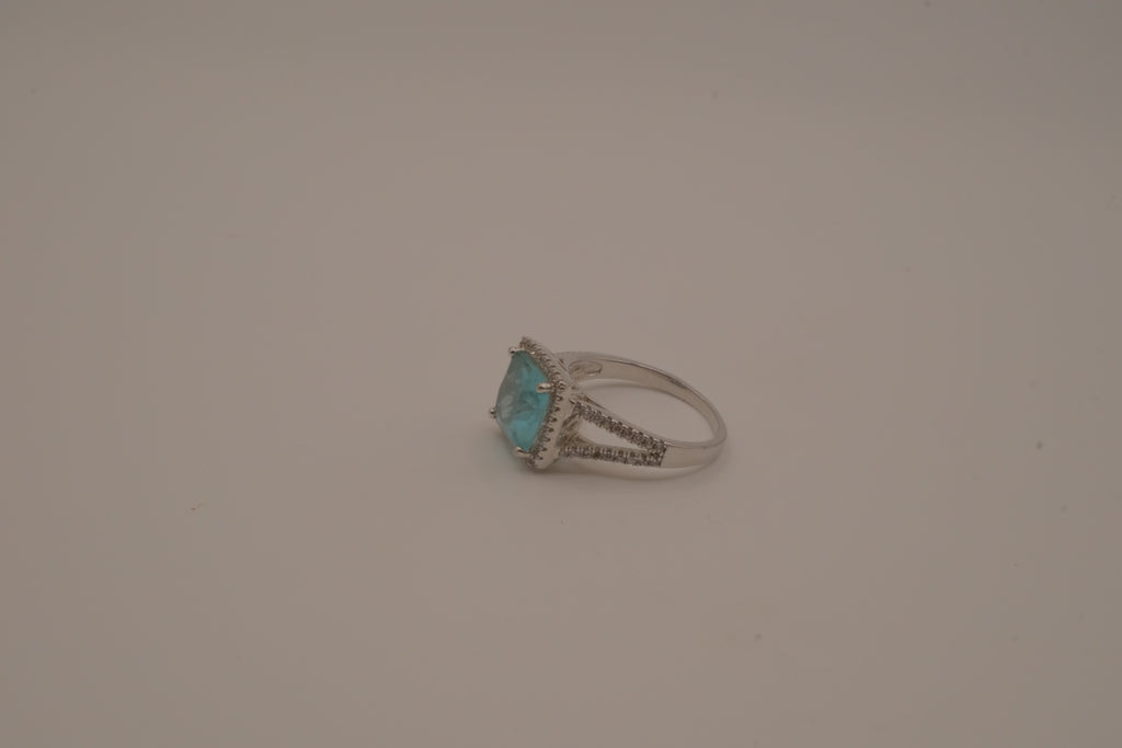 Cushion-cut blue stone halo ring