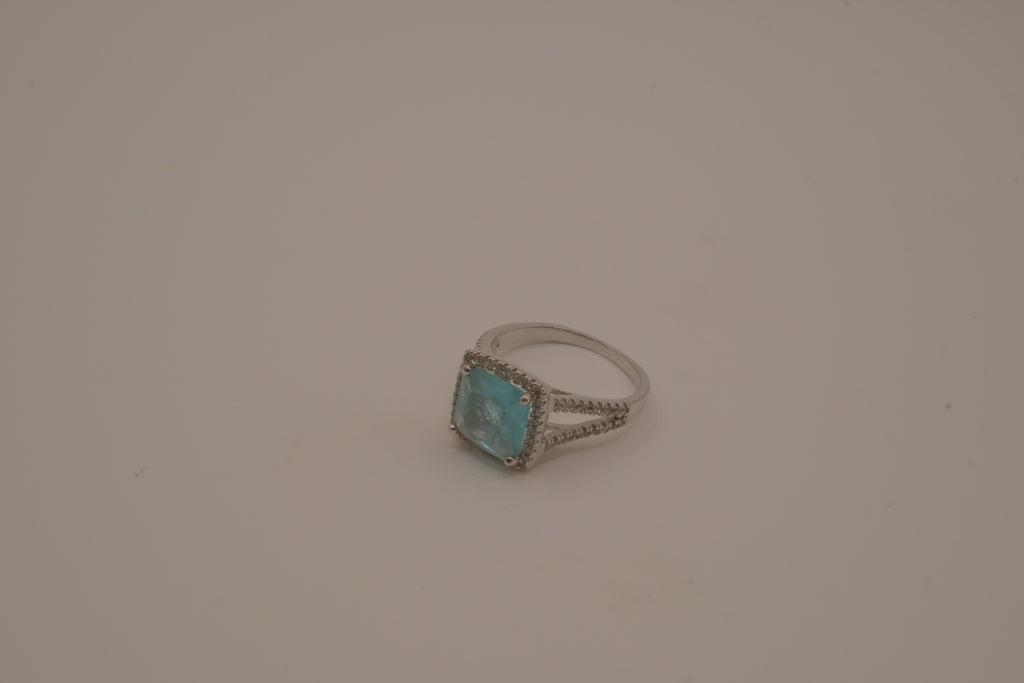 Cushion-cut blue stone halo ring