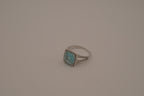 Cushion-cut blue stone halo ring