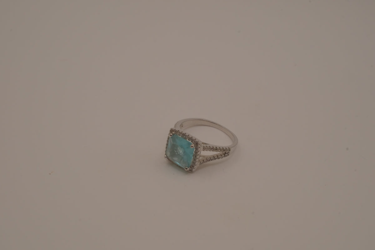 Cushion-cut blue stone halo ring