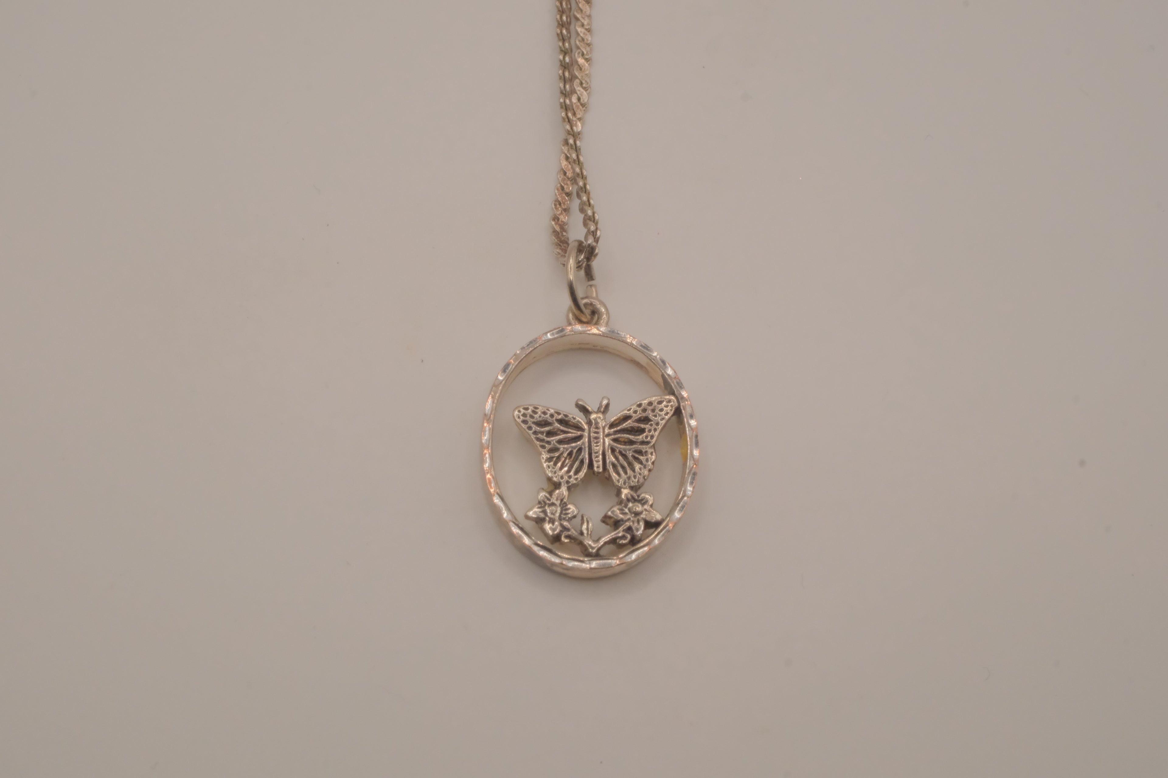 Butterfly circular pendant necklace