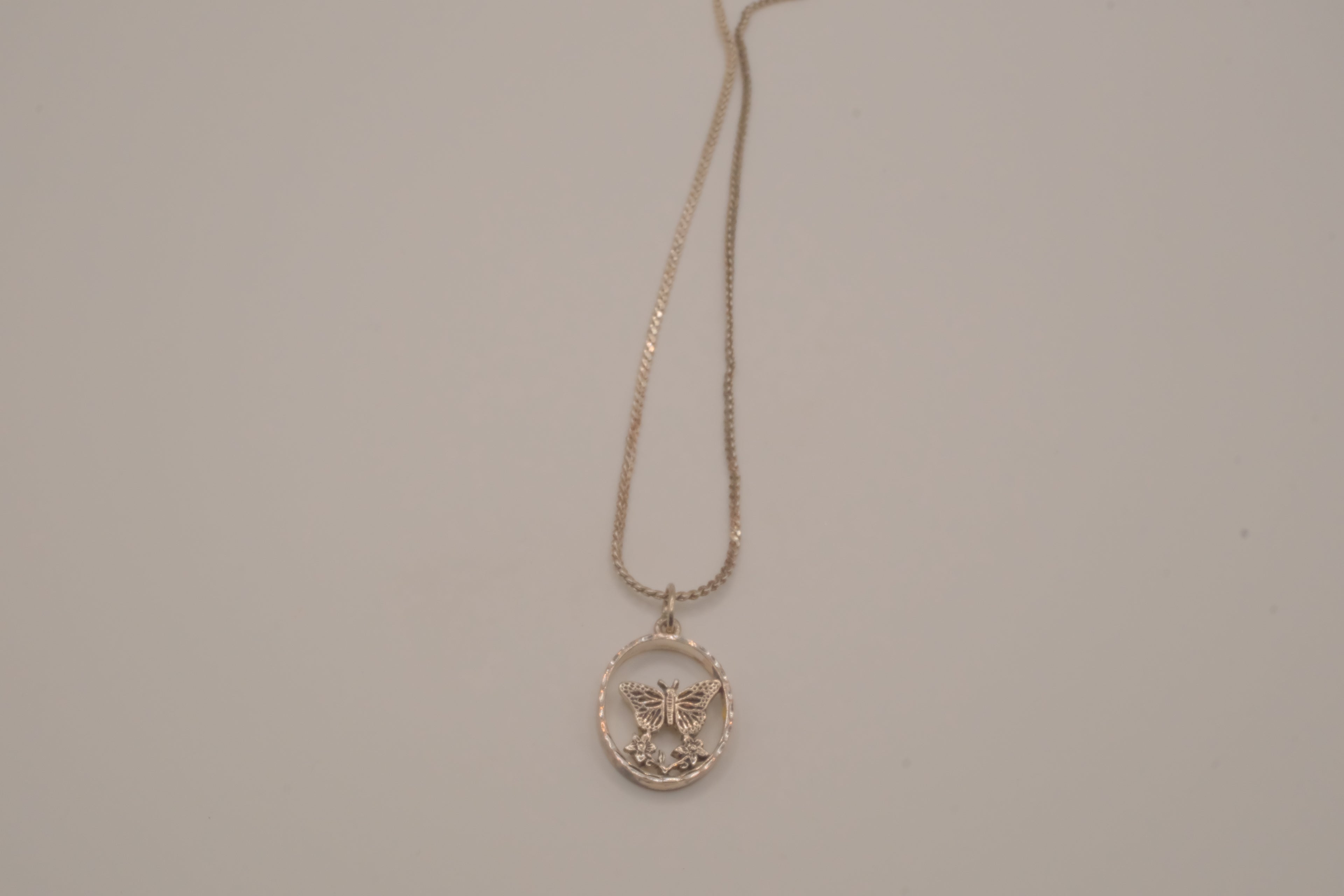 Butterfly circular pendant necklace