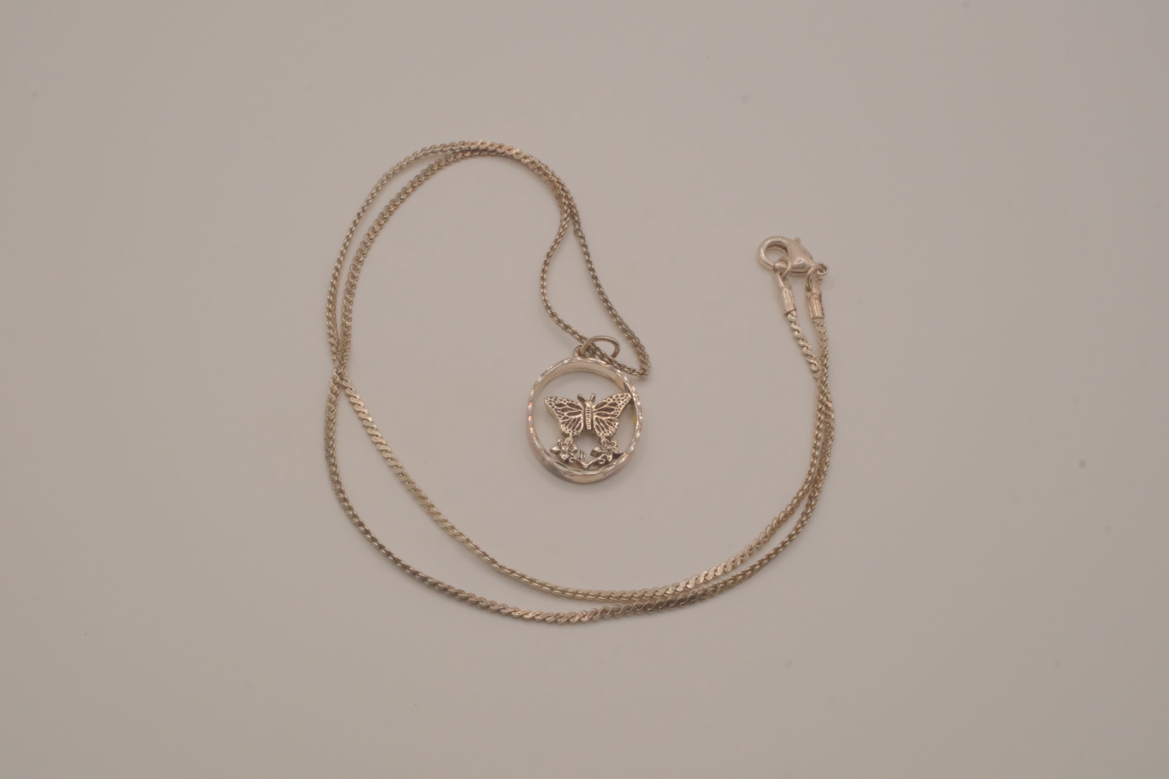 Butterfly circular pendant necklace
