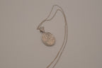Oval abalone shell and filigree scroll pendant necklace
