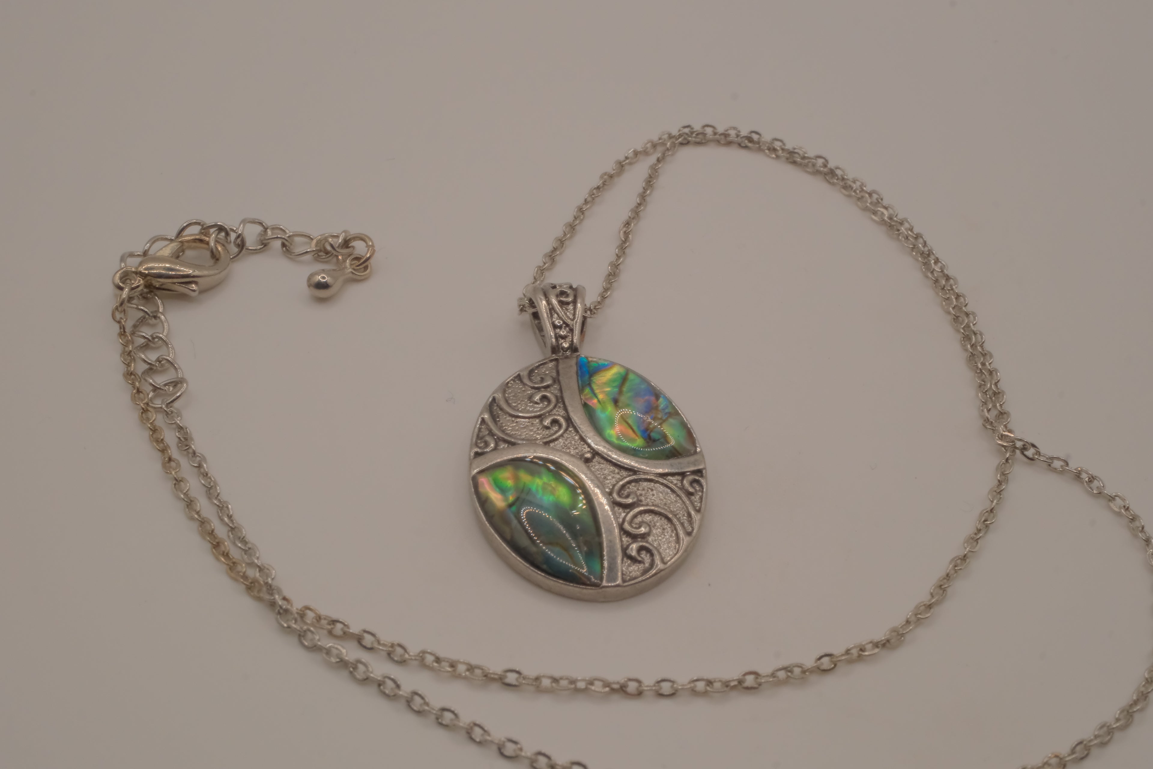 Oval abalone shell and filigree scroll pendant necklace