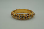 Antique-finish gold stone stone bangle