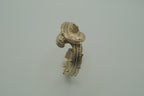 Ornate antique silver and gold-tone bypass clamper bracelet