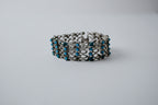 Mesh-style bracelet with turquoise-like accents&nbsp;
