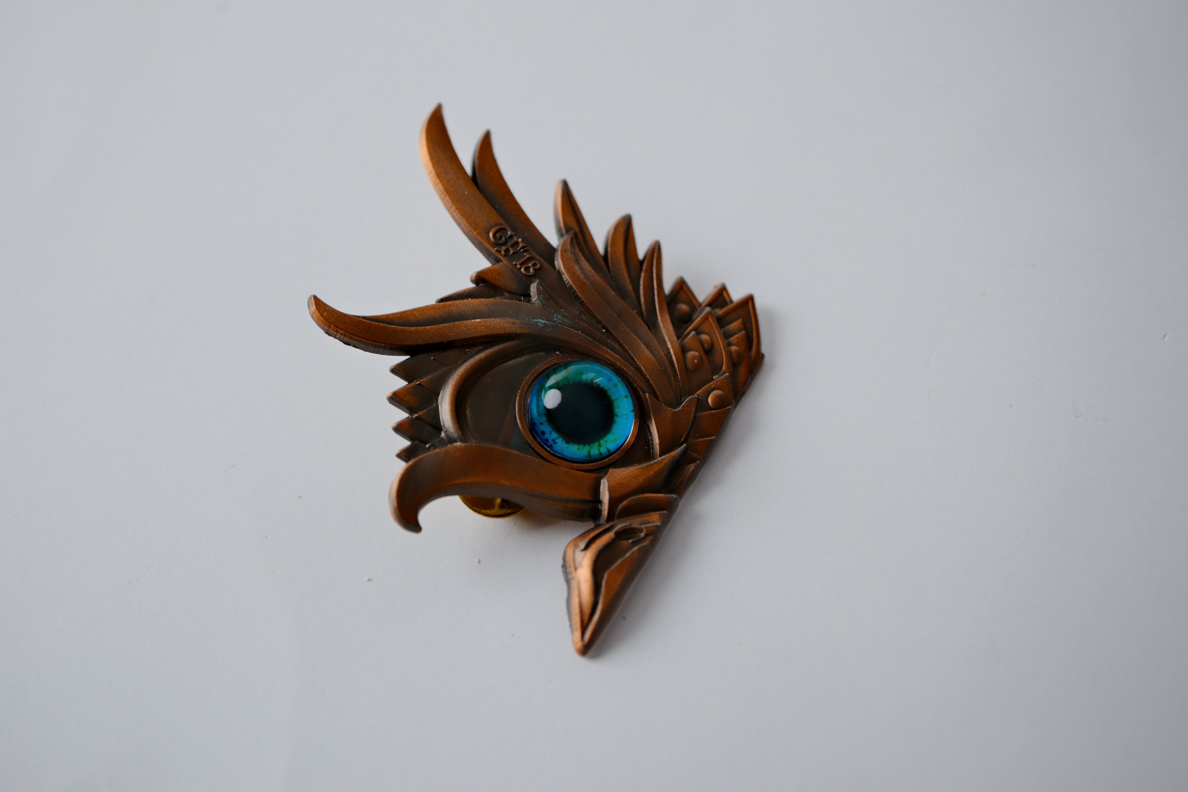 Bronze owl eye pin