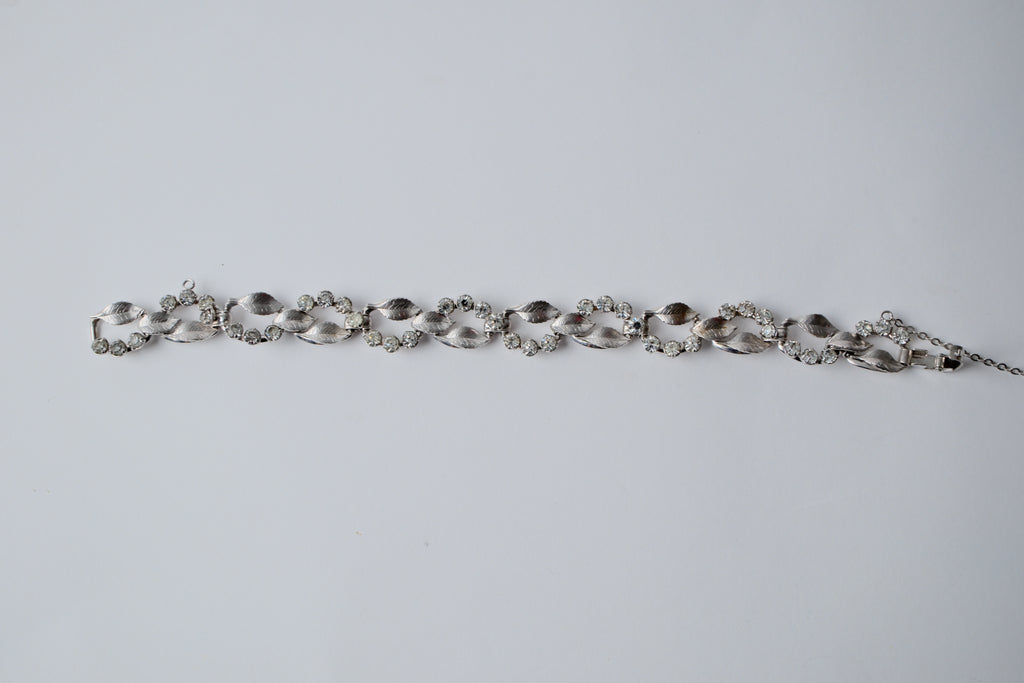 Vintage silver-tone bracelet with leaf design and rhinestones
